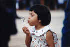 Girl blowing soap bubbles