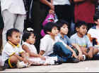 Kids watching acrobatic show