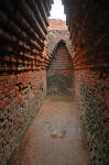 The local guides say that this is where the visiting scholar Hiuen Tsang meditated, in a dark corner at the end of this corridor (the end where the photographer stands).