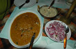 Karimeen fish masala curry + coconut milk based mixed veg curry + raw onions with salt & lemon + plain rice (at Kream House restaurant)